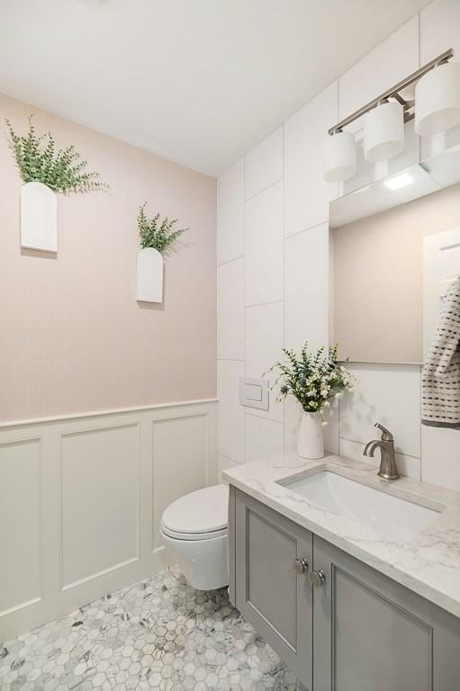 31 Orchard Rd, Hamilton, MA 01982 - bathroom featuring vanity and a decorative wall