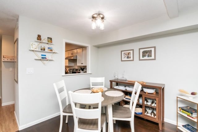 3 Beals Cv Unit F, Hingham, MA 02043 - dining space featuring dark wood finished floors and baseboards