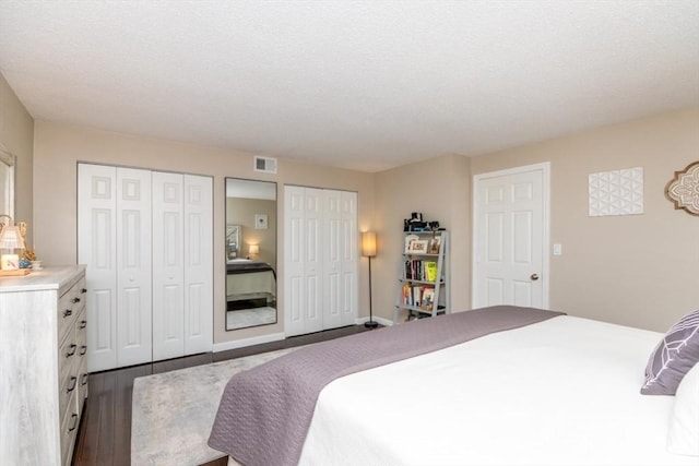 3 Beals Cv Unit F, Hingham, MA 02043 - bedroom with two closets, wood finished floors, and a textured ceiling
