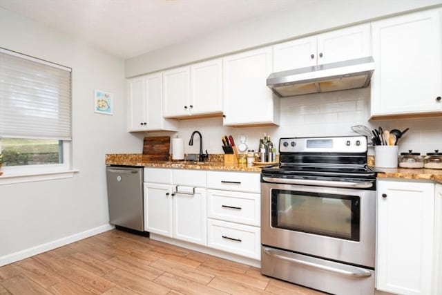 3 Beals Cv Unit F, Hingham, MA 02043 - kitchen featuring stainless steel appliances, under cabinet range hood, light wood-style floors, and white cabinets