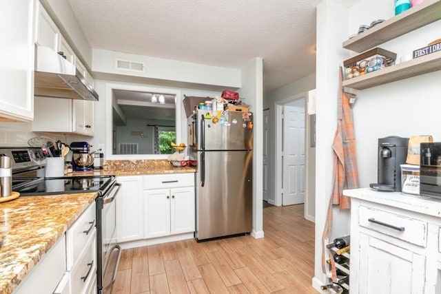 3 Beals Cv Unit F, Hingham, MA 02043 - kitchen featuring stainless steel appliances, exhaust hood, light wood finished floors, white cabinetry, and a textured ceiling