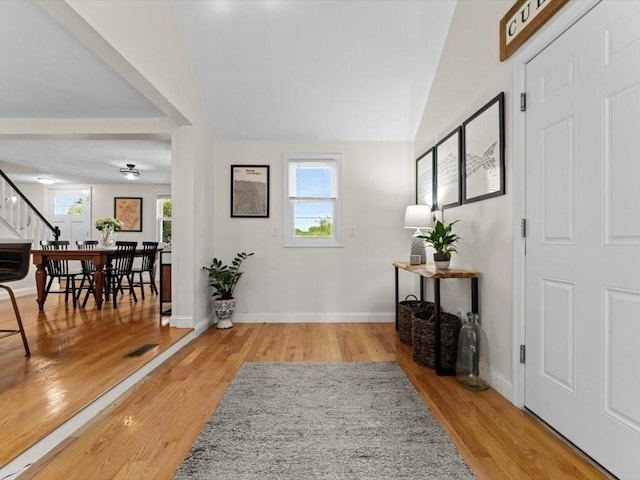 17 Clifton Ave, Scituate, MA 02066 - foyer entrance featuring wood finished floors, stairs, and vaulted ceiling