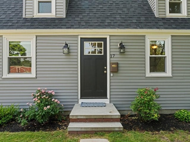 17 Clifton Ave, Scituate, MA 02066 - view of exterior entry featuring roof with shingles