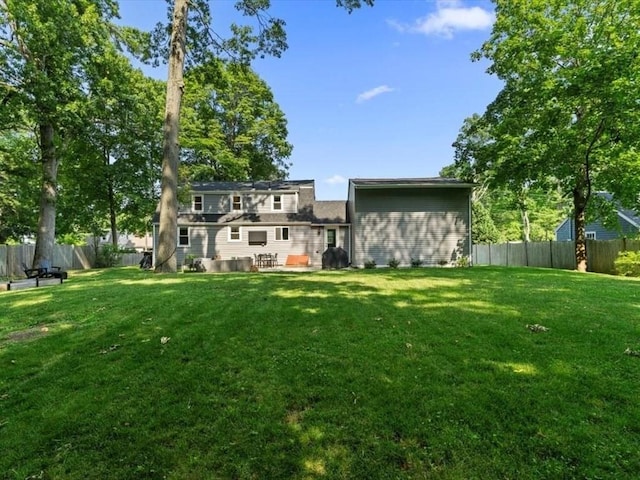 17 Clifton Ave, Scituate, MA 02066 - rear view of property featuring a fenced backyard