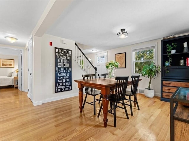 17 Clifton Ave, Scituate, MA 02066 - dining room featuring light wood-style floors and stairs