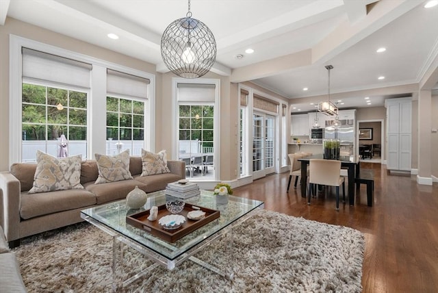 living room featuring recessed lighting, dark wood-style floors, plenty of natural light, baseboards, and a chandelier