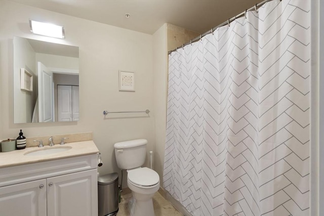 bathroom featuring toilet, vanity, and a shower with shower curtain