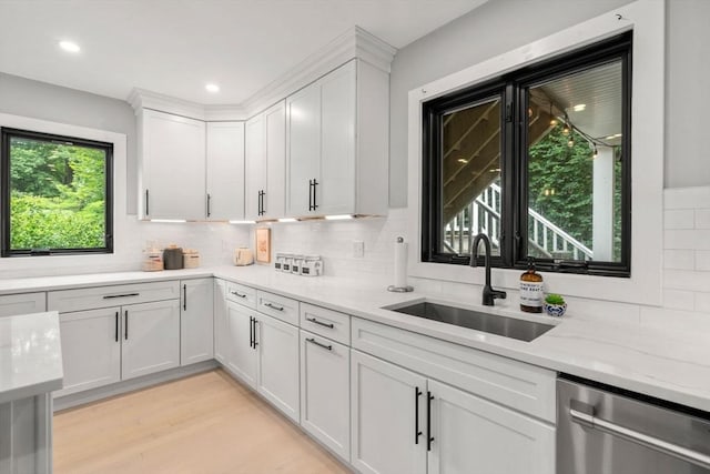 103 Warwick Rd Unit 103, Newton, MA 02465 - kitchen featuring dishwasher, white cabinetry, backsplash, light stone counters, and recessed lighting