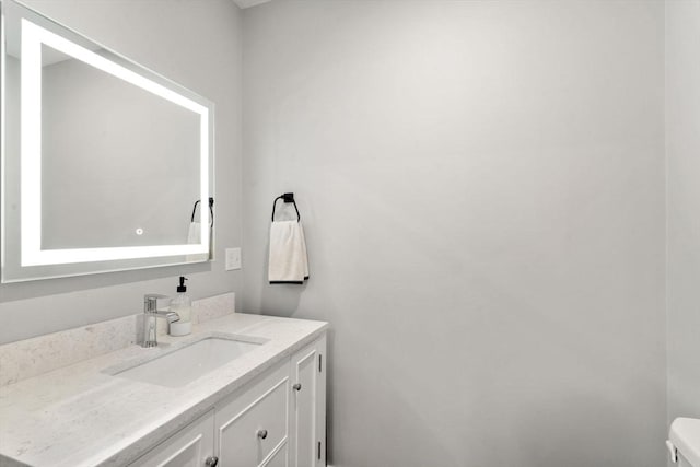 103 Warwick Rd Unit 103, Newton, MA 02465 - half bathroom featuring vanity and toilet