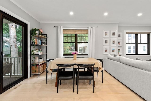 103 Warwick Rd Unit 103, Newton, MA 02465 - dining area featuring healthy amount of natural light, recessed lighting, crown molding, and light wood-style flooring