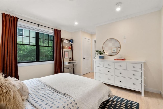 103 Warwick Rd Unit 103, Newton, MA 02465 - bedroom with light wood finished floors and ornamental molding