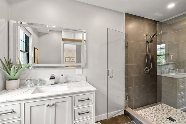 103 Warwick Rd Unit 103, Newton, MA 02465 - bathroom featuring vanity, a stall shower, recessed lighting, and plenty of natural light