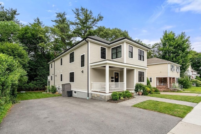 103 Warwick Rd Unit 103, Newton, MA 02465 - american foursquare style home with covered porch and a front yard