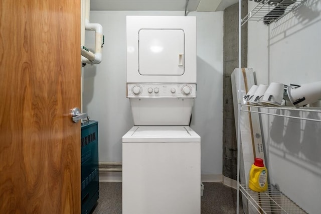 laundry area with stacked washing maching and dryer