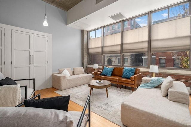 living room with light hardwood / wood-style flooring