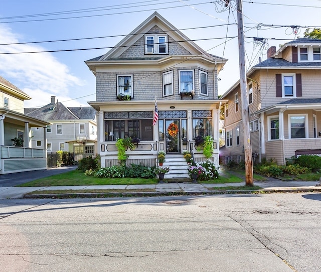 victorian-style house featuring a porch