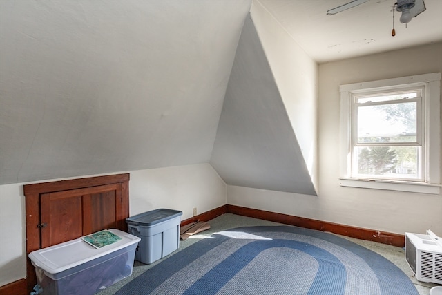 bonus room with ceiling fan, lofted ceiling, and carpet flooring