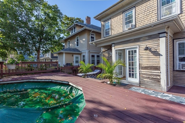 view of pool with a wooden deck