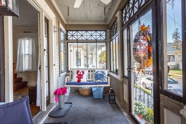 sunroom featuring ceiling fan