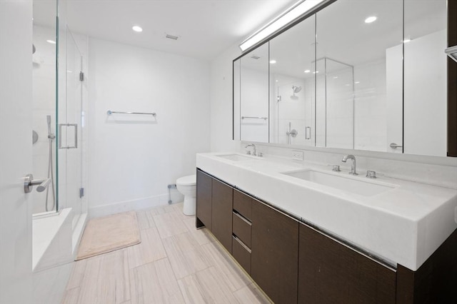 100 Lovejoy Wharf Unit 6J, Boston, MA 02114 - full bath with double vanity, toilet, a shower stall, baseboards, and recessed lighting