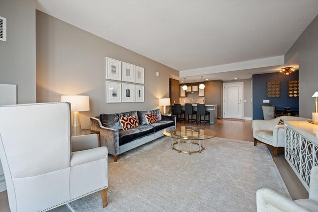 100 Lovejoy Wharf Unit 6J, Boston, MA 02114 - living room with recessed lighting and wood finished floors