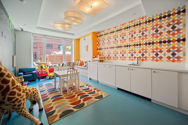 100 Lovejoy Wharf Unit 6J, Boston, MA 02114 - playroom with a sink and a tray ceiling