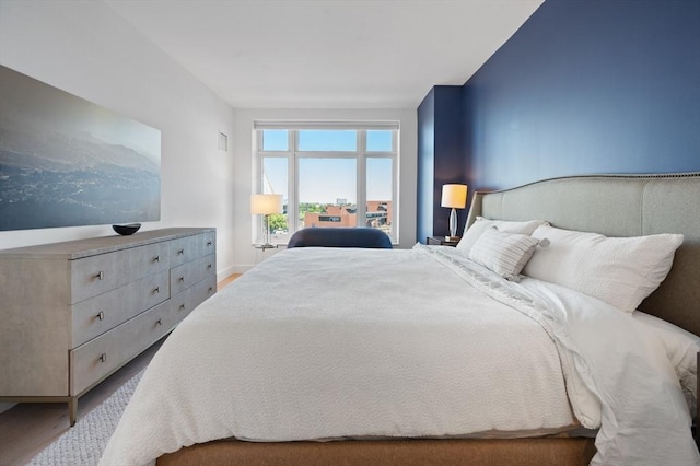 100 Lovejoy Wharf Unit 6J, Boston, MA 02114 - bedroom featuring wood finished floors and baseboards