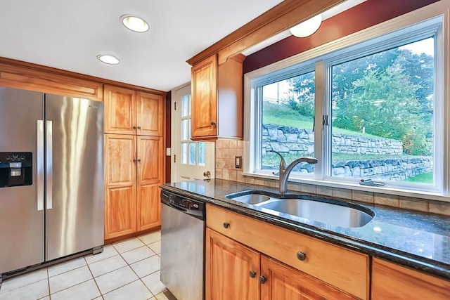 371-377 Franklin St, Wrentham, MA 02093 - kitchen with stainless steel appliances, a sink, dark stone countertops, light tile patterned flooring, and brown cabinets