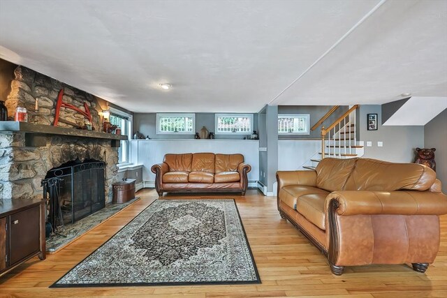 371-377 Franklin St, Wrentham, MA 02093 - living area with light wood finished floors, a fireplace, stairway, and healthy amount of natural light