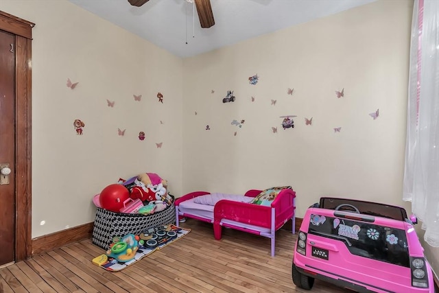 bedroom featuring ceiling fan and light hardwood / wood-style floors