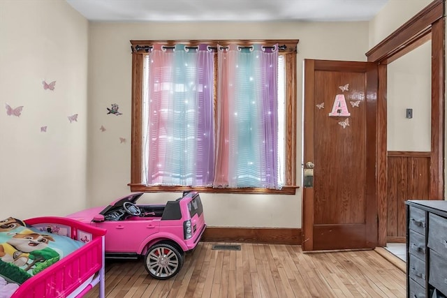 bedroom with light hardwood / wood-style flooring