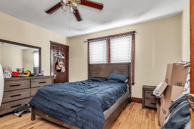 bedroom featuring ceiling fan and light wood-type flooring