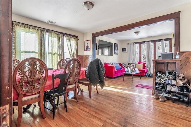 dining area with light hardwood / wood-style flooring and plenty of natural light