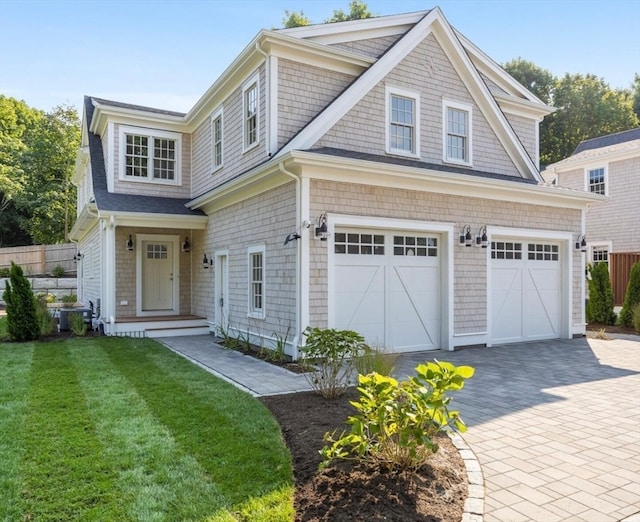 view of front of property with a garage and a front yard