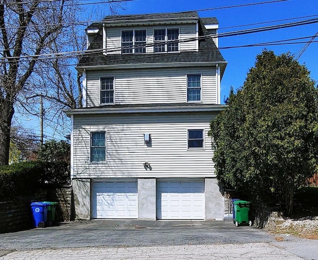 97-99 N St Unit 97, Newton, MA 02460 - victorian home featuring a garage and asphalt driveway