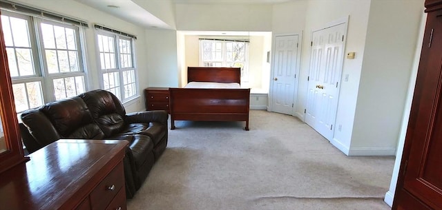 97-99 N St Unit 97, Newton, MA 02460 - bedroom featuring light colored carpet, baseboards, and multiple closets
