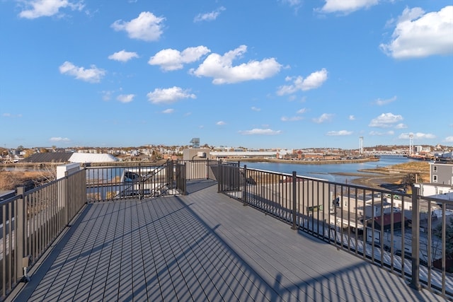 wooden deck featuring a water view