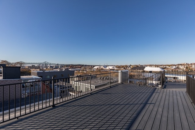 wooden terrace featuring a water view