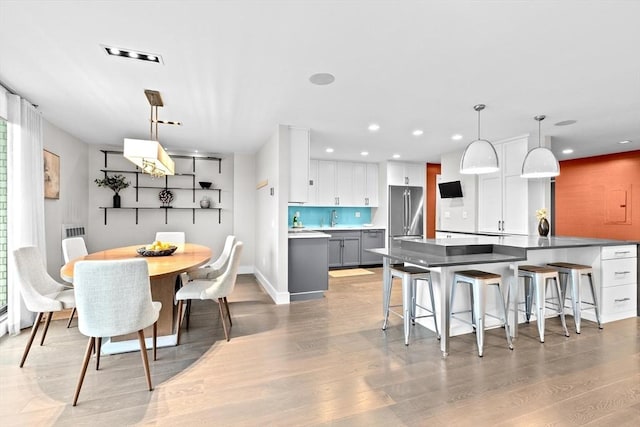 50 Longwood Ave Unit 1016/1017, Brookline, MA 02446 - dining space with light wood finished floors, recessed lighting, and baseboards