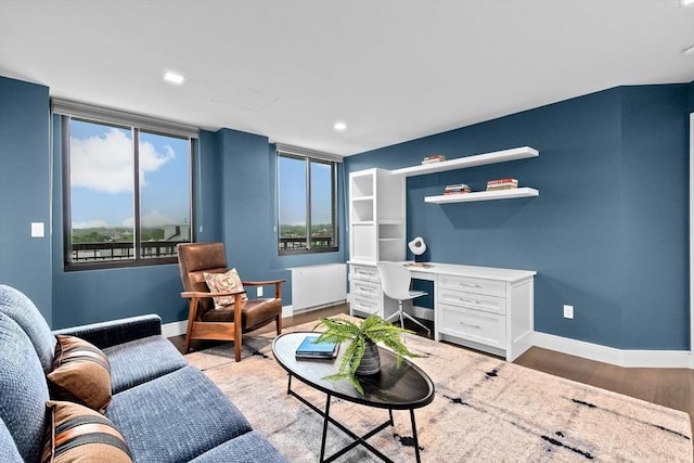 50 Longwood Ave Unit 1016/1017, Brookline, MA 02446 - living room with light wood-style floors, radiator, baseboards, and recessed lighting