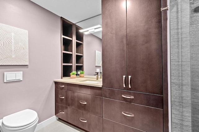 50 Longwood Ave Unit 1016/1017, Brookline, MA 02446 - bathroom featuring baseboards, vanity, and toilet