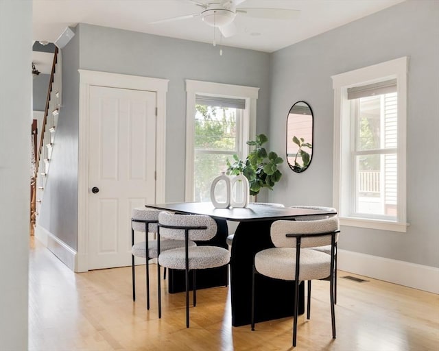 15 Berkeley St, Somerville, MA 02143 - dining space featuring a ceiling fan, stairs, and light wood-style flooring