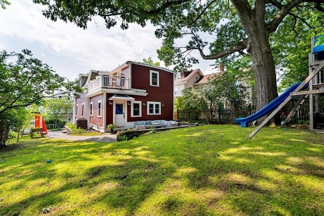 15 Berkeley St, Somerville, MA 02143 - back of property with a balcony, a playground, and outdoor lounge area