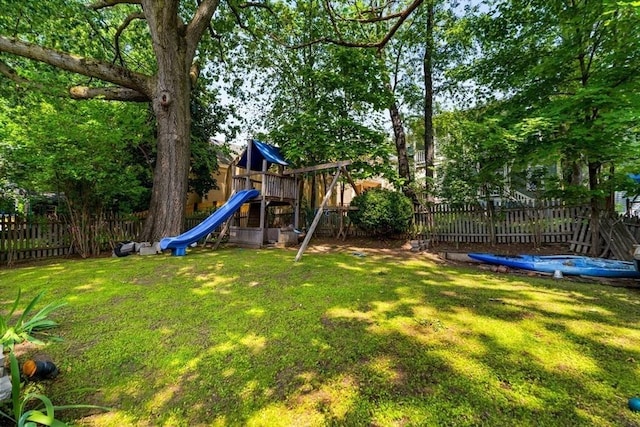 15 Berkeley St, Somerville, MA 02143 - fenced backyard with a playground