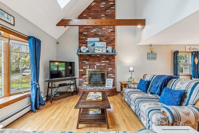22 Woodside Dr, Falmouth, MA 02536 - living room featuring a baseboard heating unit, high vaulted ceiling, plenty of natural light, wood finished floors, and beam ceiling