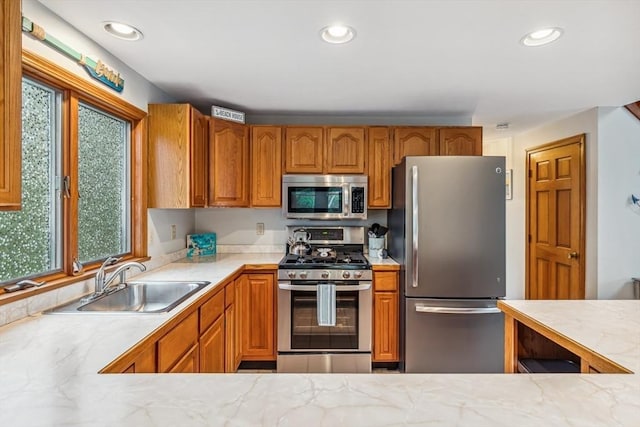 22 Woodside Dr, Falmouth, MA 02536 - kitchen with appliances with stainless steel finishes, a sink, healthy amount of natural light, light countertops, and recessed lighting