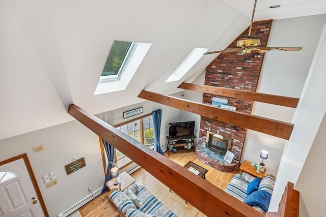 22 Woodside Dr, Falmouth, MA 02536 - living area featuring a skylight, wood finished floors, ceiling fan, and high vaulted ceiling