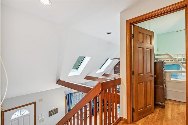 22 Woodside Dr, Falmouth, MA 02536 - corridor featuring a skylight, wood finished floors, recessed lighting, and an upstairs landing