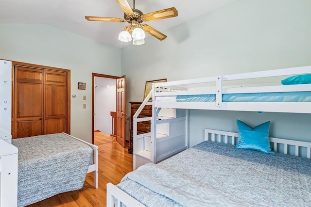 22 Woodside Dr, Falmouth, MA 02536 - bedroom with wood finished floors, vaulted ceiling, ceiling fan, and a closet