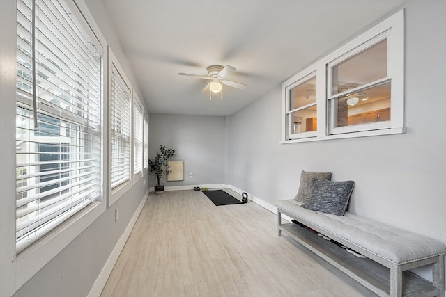 sitting room with light hardwood / wood-style flooring and ceiling fan